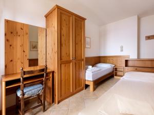 Postel nebo postele na pokoji v ubytování Residence Besass, GTSGroup