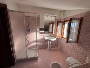 a bathroom with a shower and a sink at Casa Laura in Porto Garibaldi +37 photos