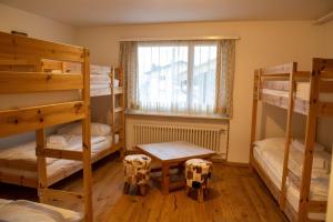 Postel nebo postele na pokoji v ubytování Madrisa Lodge