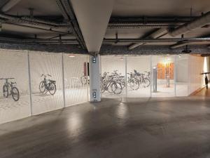 a room with drawings of bicycles on the wall at Studio en Duplex-Aircon-Terrasse-Parking-Calme in Bordeaux