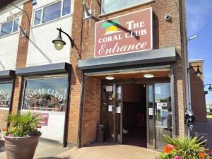 a building with a sign that reads the coral club entrance at Skegness Ingoldmells near Skegness raceway holiday let by Sophia in Ingoldmells