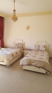 En eller flere senge i et værelse på Al Khaleej Hotel Apartments