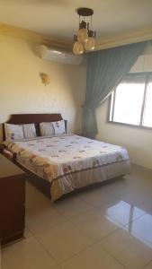 Postel nebo postele na pokoji v ubytování Al Khaleej Hotel Apartments
