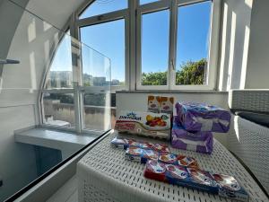 a table with snacks on it in a room with windows at Casa Vacanze Aurelia in Procida