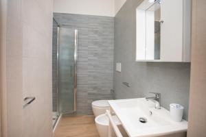 a bathroom with a sink and a toilet at CASA GARIBALDI 162 in Leverano +34 photos