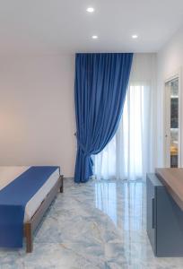 Postel nebo postele na pokoji v ubytování Maison Matie B&B Ercolano