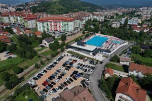 an aerial view of a parking lot with a swimming pool at Apartments M&J in Sarajevo