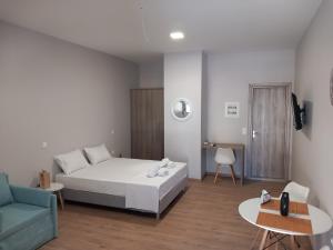 Postel nebo postele na pokoji v ubytování THALASSA ALMYROS APARTMENTS
