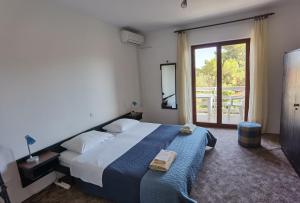 Posteľ alebo postele v izbe v ubytovaní Apartments MOST