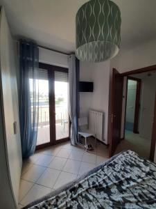 Ένα ή περισσότερα κρεβάτια σε δωμάτιο στο Casa vacanze Cerezo