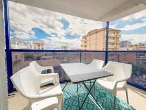 a balcony with a table and chairs and a view at SoleOle in Playa de Gandia