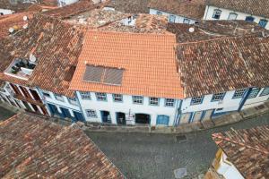 an overhead view of a white building with an orange roof at Casa Carmo in Ouro Preto +11 photos
