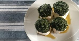 a plate of food with broccoli on a table at le faye in Envie