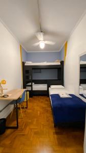 Postel nebo postele na pokoji v ubytování Lamparina Hostel
