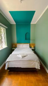Postel nebo postele na pokoji v ubytování Lamparina Hostel