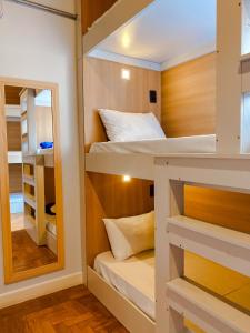 Postel nebo postele na pokoji v ubytování Lamparina Hostel