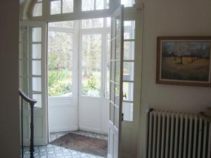 an open door in a room with a window at Chalet Du Bel Event in La Chapelle-sur-Dun