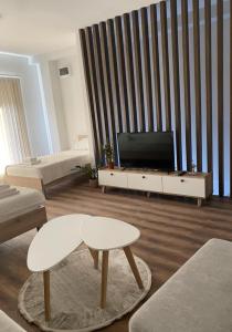 TV a/nebo společenská místnost v ubytování Valentina Apartament