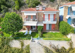 an aerial view of a house with a yard at Hermes villa Possidi in Possidi