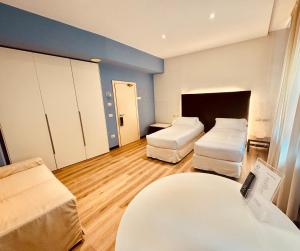Postel nebo postele na pokoji v ubytování Hotel Pex Mantova