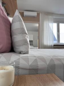 Ένα ή περισσότερα κρεβάτια σε δωμάτιο στο Post apartmani A-1