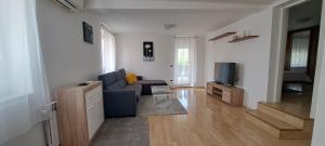 TV a/nebo společenská místnost v ubytování San Lorenzo Apartments