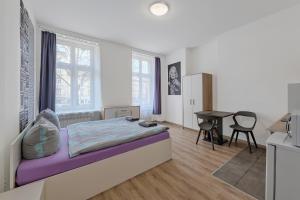 Posteľ alebo postele v izbe v ubytovaní Queen Apartments