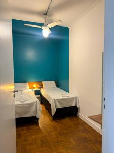 Postel nebo postele na pokoji v ubytování Lamparina Hostel
