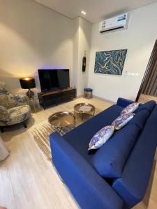 TV a/nebo společenská místnost v ubytování Hawana Salalah Poolside Apartment