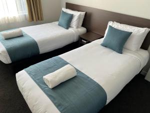 Postel nebo postele na pokoji v ubytování Airport Delta Motel