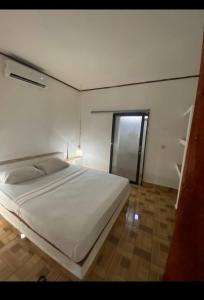 Ένα ή περισσότερα κρεβάτια σε δωμάτιο στο Mellow Hostel
