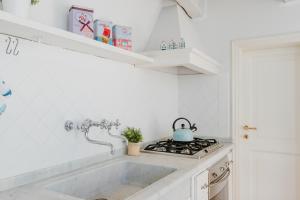 Kuchyň nebo kuchyňský kout v ubytování Maison Cirì + 49 fotografií