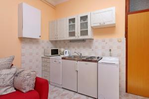 Kuchyňa alebo kuchynka v ubytovaní Apartments with a parking space Opatija - Pobri, Opatija - 7813 + 17 fotografií
