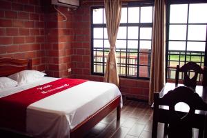 Voodi või voodid majutusasutuse Hotel International toas