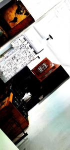 a room with two tables with drawings on them at Apartamento POSADAS in Posadas