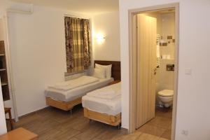 Posteľ alebo postele v izbe v ubytovaní Esprit Hotel