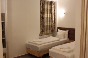 Posteľ alebo postele v izbe v ubytovaní Esprit Hotel