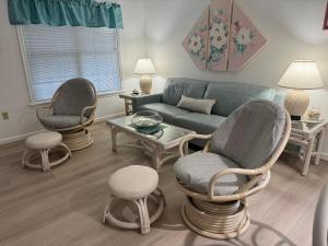 a living room with two chairs and a couch at Perfect Family Vacation at Bethany Beach Cottages! in Bethany Beach