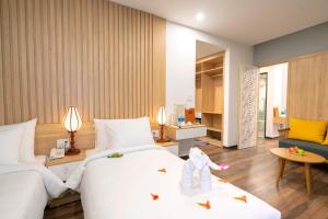 Giường trong phòng chung tại Hoi An Grace River Villa