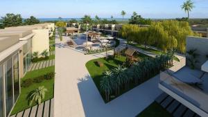 Una vista aérea de un edificio con palmeras y un patio. en Casa Morada do toque l By milagres hospitalidade, en São Miguel dos Milagres