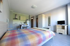 TV a/nebo společenská místnost v ubytování B&B La Castellana