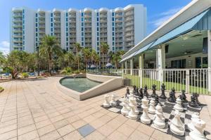 a giant chess board in front of a large building at 1st Floor Palms of Destin Resort Updated Condo with Beach Shuttle in Destin