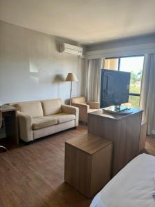 Televisyen dan/atau pusat hiburan di Flat Completo - LakeSide Hotel