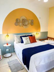 Postel nebo postele na pokoji v ubytování Pousada Villa Real Paraty - Localização e café da manhã EXCELENTES"