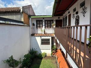 an external view of a house with a balcony at Hotel Casa Blanca Antigua Guatemala in Antigua Guatemala