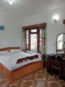 Postel nebo postele na pokoji v ubytování New Summit Guest House