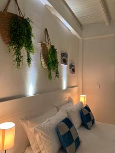 Rúm í herbergi á La Excelencia Posada & Spa