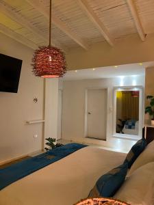 Rúm í herbergi á La Excelencia Posada & Spa