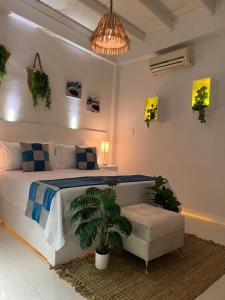 Rúm í herbergi á La Excelencia Posada & Spa
