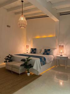 Rúm í herbergi á La Excelencia Posada & Spa